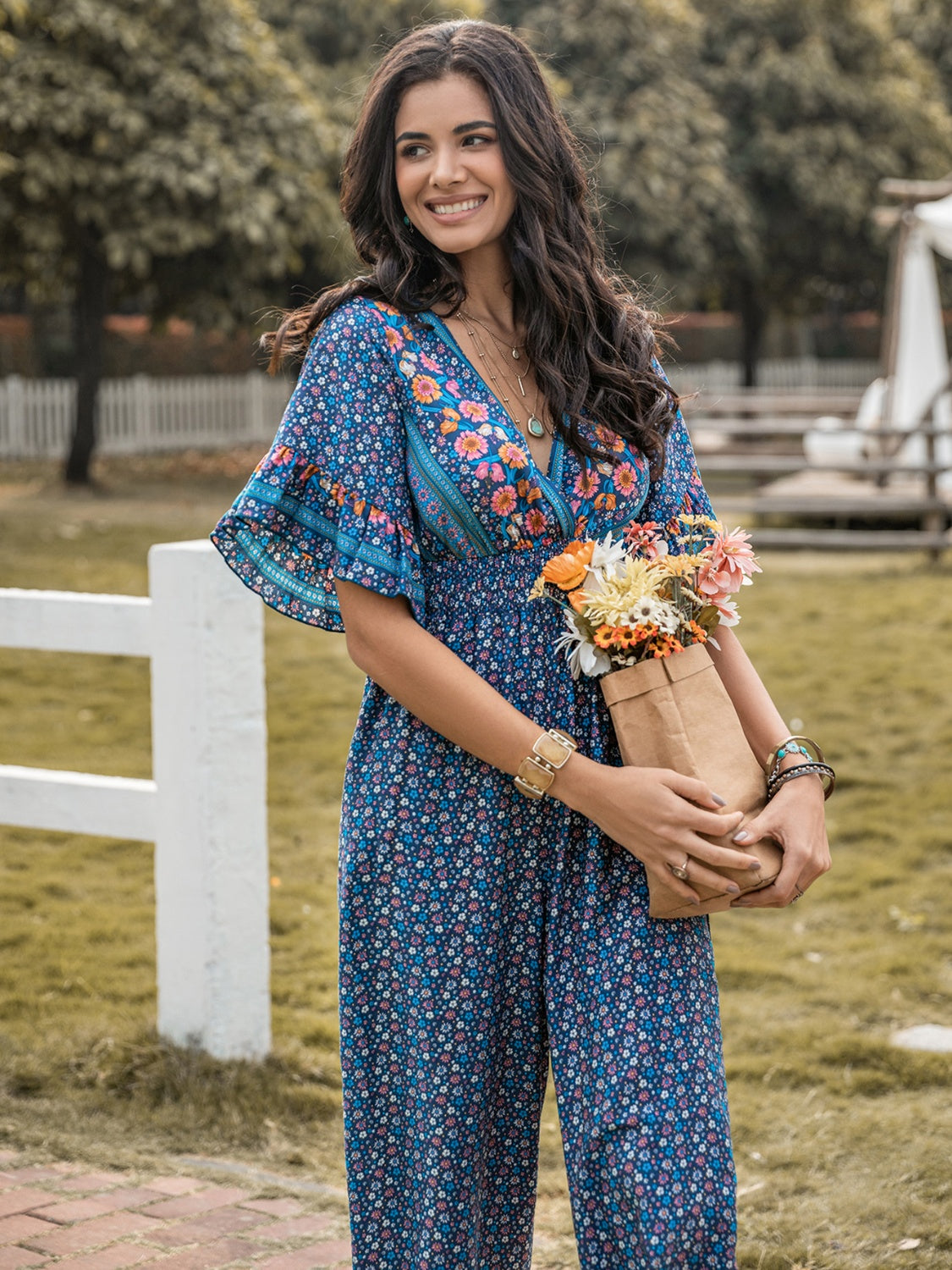 Honeybee Mumford's Floral Surplice Flutter Sleeve Jumpsuit