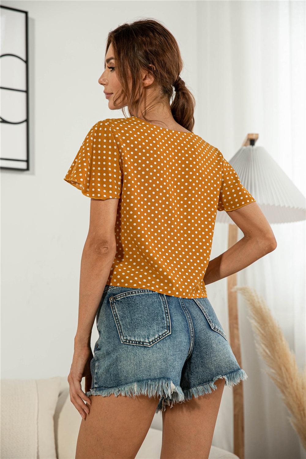 Honeybee Mumford's Decorative Button V-Neck Tied Blouse