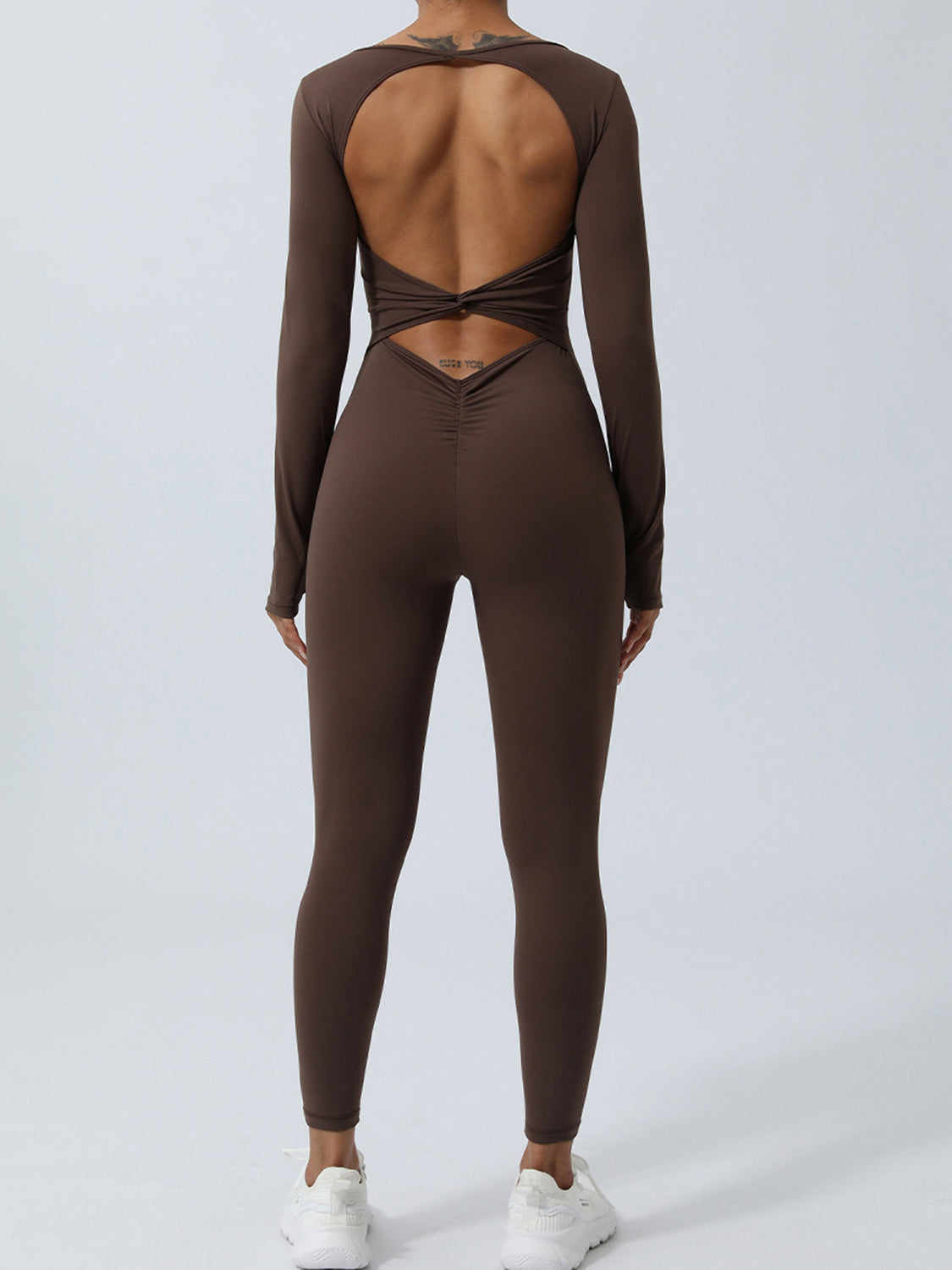 Honeybee Mumford's Twisted Backless Long Sleeve Jumpsuit