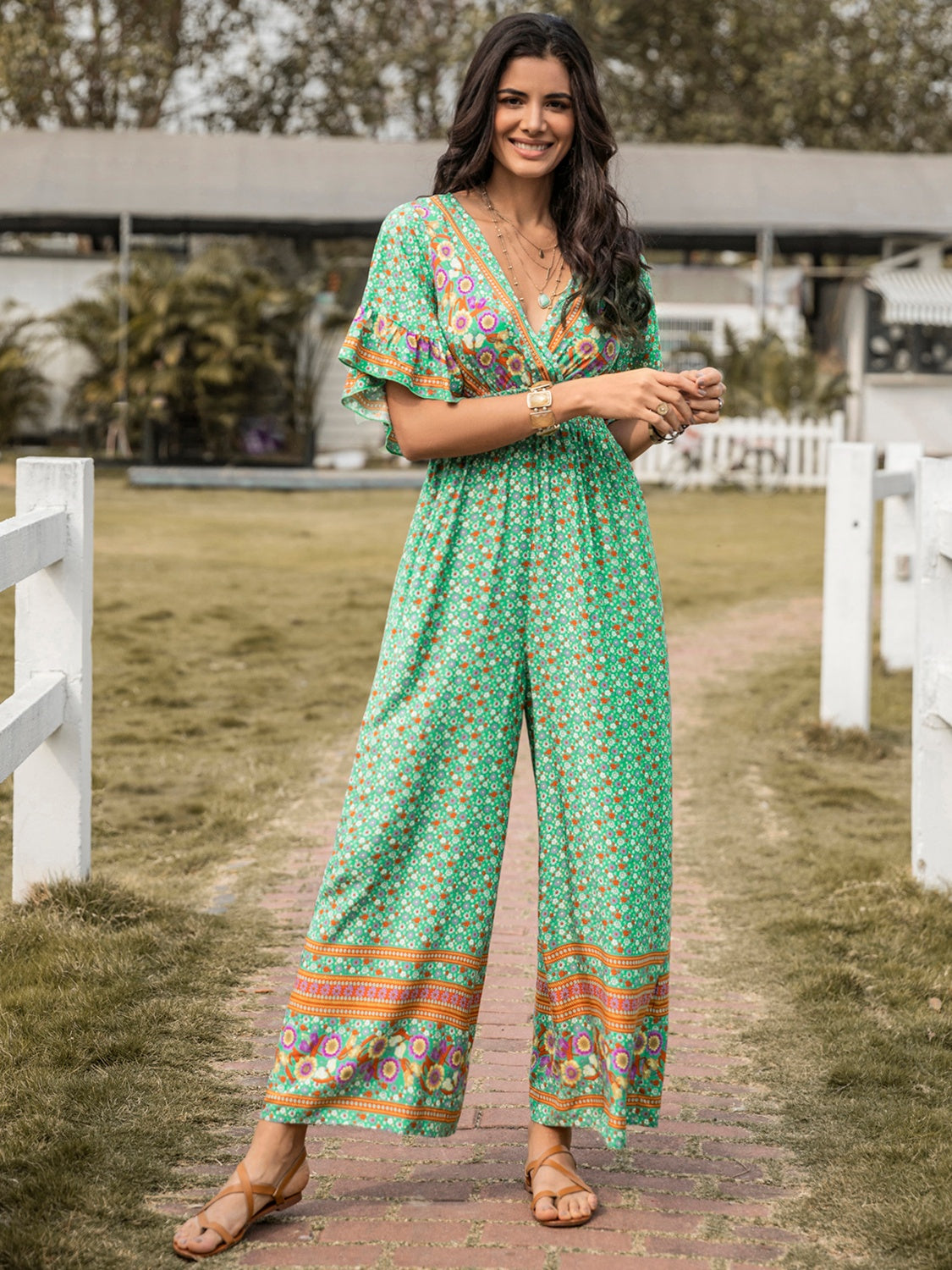 Honeybee Mumford's Floral Surplice Flutter Sleeve Jumpsuit