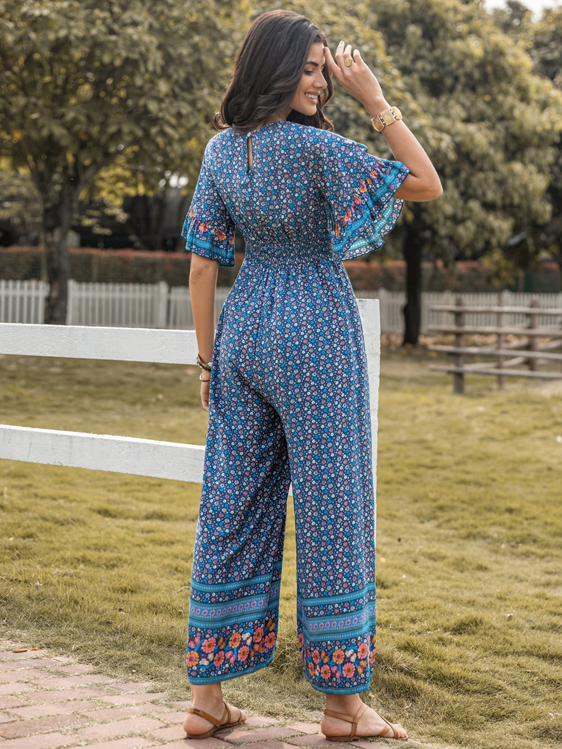 Honeybee Mumford's Floral Surplice Flutter Sleeve Jumpsuit