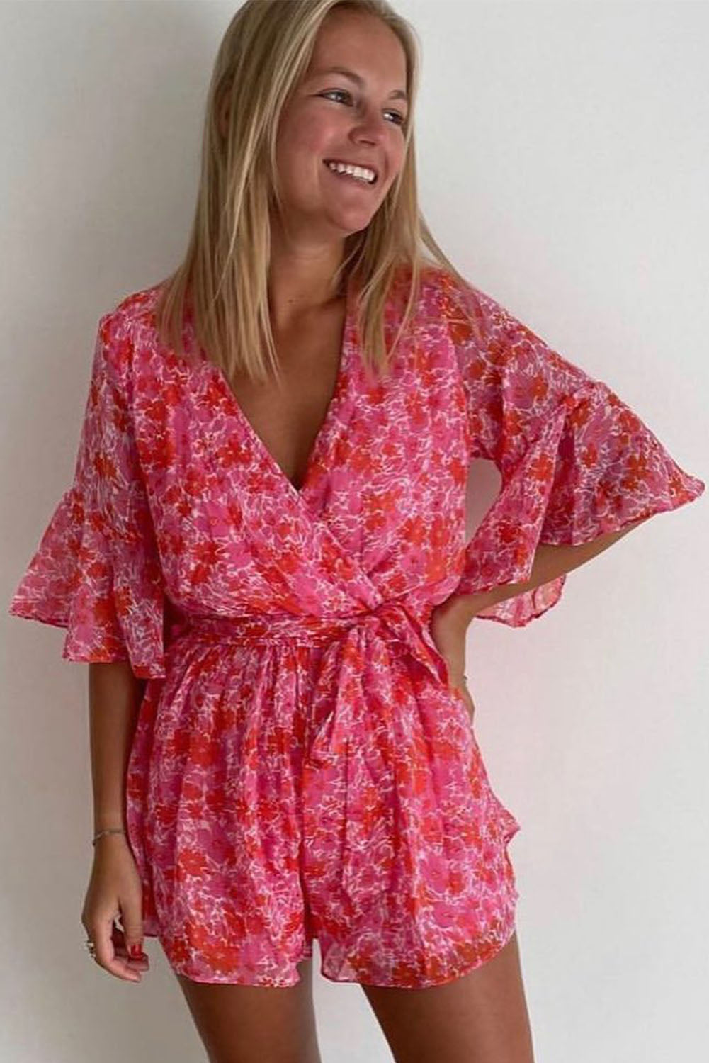 Honeybee Mumford's Pink V Neck Ruffled Sleeve Floral Romper