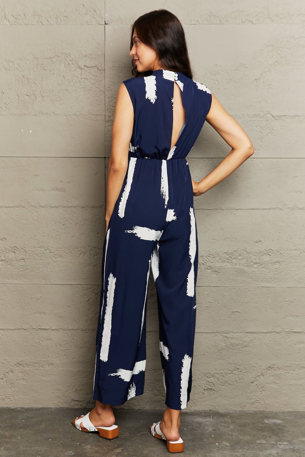 Honeybee Mumford's Printed Round Neck Cutout Jumpsuit with Pockets