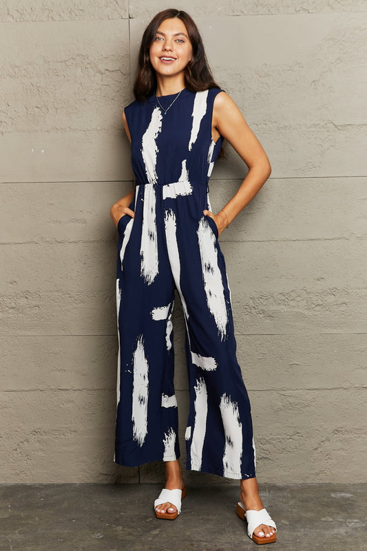 Honeybee Mumford's Printed Round Neck Cutout Jumpsuit with Pockets